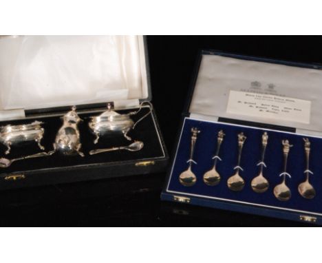 A modern hallmarked silver cruet set comprising of salt, covered mustard and pepper, each with cut edge border, cased, Birmin