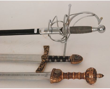 A replica Spanish Roman gladius style sword, engraved blade below wooden grip and brass fittings, a similar sword with leathe