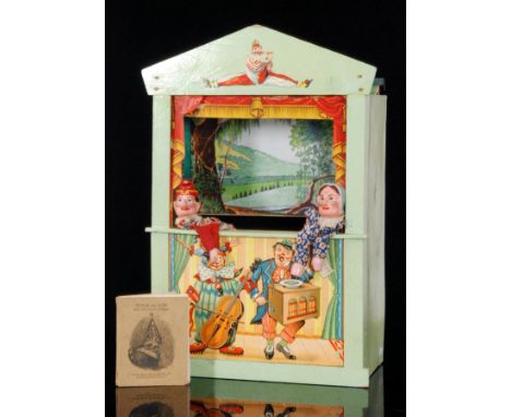 A 1940s green painted wooden portable Punch and Judy show with puppets, the front, transfer printed with a paper inset panel 