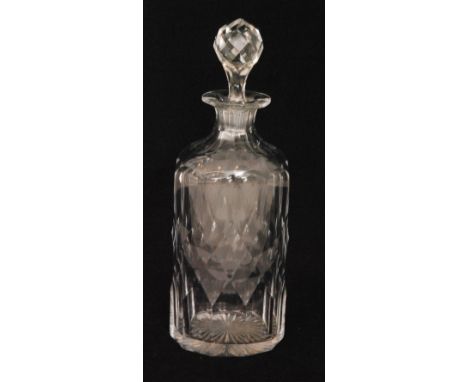 A late 19th Century clear cut crystal glass decanter of compressed, shouldered form with hollow diamond cut body below a slic