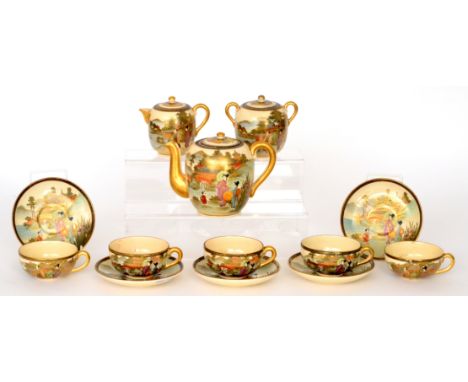 A late 19th Century Japanese Satsuma teaset comprising teapot, lidded milk jug, sucrier and six teacups and saucers, each dec