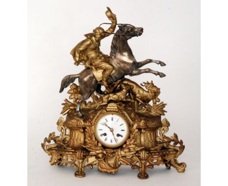 A 19th French gilt mantle clock in the form of a rider on horse back with hound and stag in flight over a circular movement a