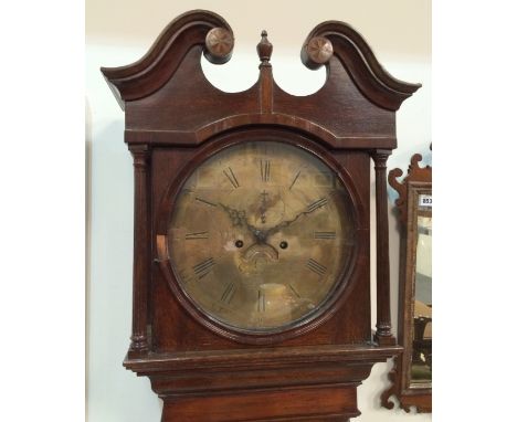 A 19th Century oak longcase clock with an eight day movmement, the twin scroll pediment above the 13 inch diameter brass dial