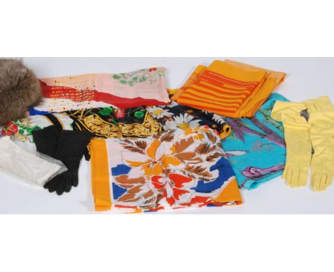 A quantity of hair, clothes and millinery accessories to include silk flowers, hair garlands, netting etc. together with a la
