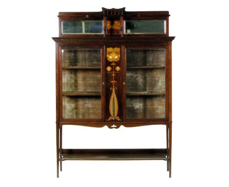 An Art Nouveau mahogany salon side cabinet, the upright section with a small galleried shelf, inlaid panel and two shallow mi