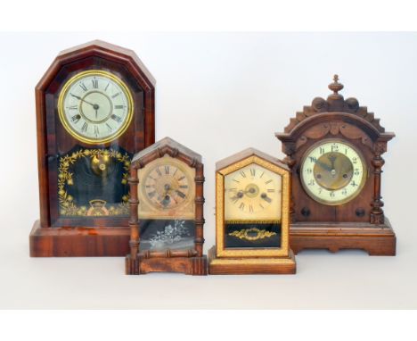 An American mahogany cased mantle clock striking on a gong, the movement enclosed by a stencilled leaf glass door together wi