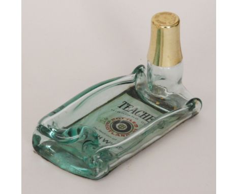 A Strathearn Glass Co novelty ash tray created from a Teachers Scotch Whisky bottle by Vincent Ysart, length 19cm. 