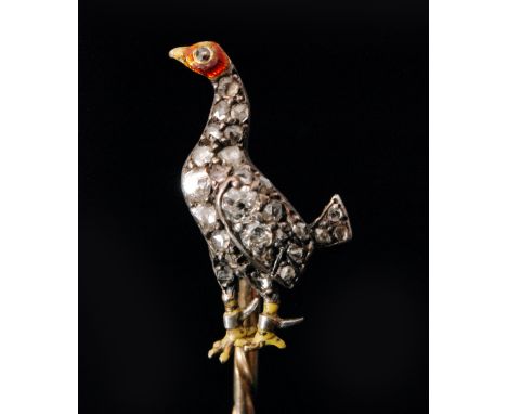 A Victorian diamond set novelty stick pin designed as a standing fighting cock, the body all over set with old cut diamonds, 