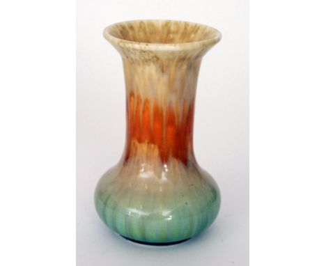 A Ruskin Pottery crystalline glaze vase of globe and shaft form decorated with a streaked yellow to orange to pale blue, inci