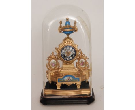 A late 19th French Century gilt metal mantle clock with eight day striking movement, the case mounted with a sevres style urn