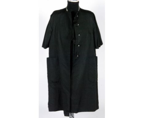 A 1960s Pauline Trigere black silk faille coat with short flared sleeves and rhinestone buttons, gold lining length 100cm, si