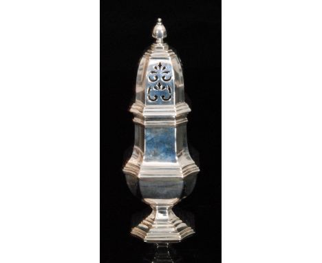 A George VI hallmarked silver sugar sifter, of ribbed baluster form with canted sides, conforming pierced cover with octagona