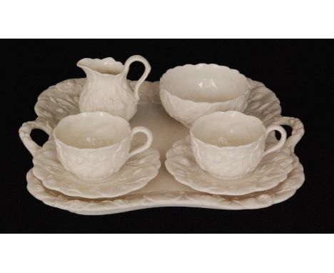 A late 19th Century Minton Lotus pattern seven piece Parian cabaret set comprising twin handled tray, sugar bowl, milk jug an