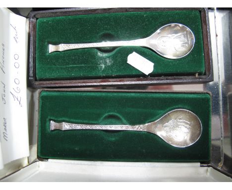 Two 1970's Franklin Mint Hallmarked Silver Spoons, designed by Peter Jackson "The John Pinches Christmas Spoon", each with ce
