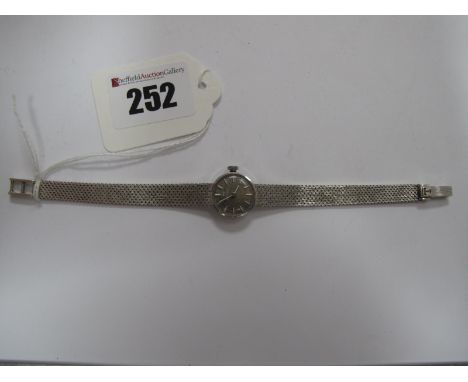 Tissot; A Vintage Ladies Wristwatch, the (discoloured) signed dial with line markers, within plain case, stamped "18K 0.750",