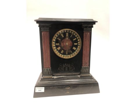 EGYPTIAN REVIVAL BLACK SLATE MANTEL CLOCK, two train eight day movement, the Black chapter ring with Roman numerals, pillared
