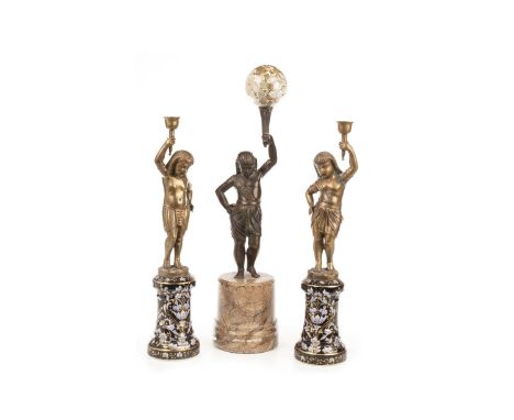 CAST BRONZED FIGURE OF A BOY ATTENDANT, holding aloft a marble sphere, on a cylindrical marble base, 48 cm high; along with a