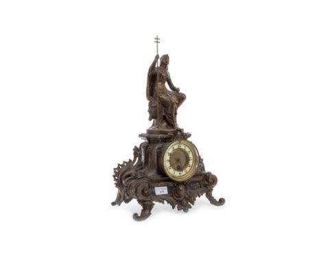 EGYPTIAN REVIVAL MANTEL CLOCK, one train thirty hour movement, the white enamel dial with Arabic numerals, the spelter case h