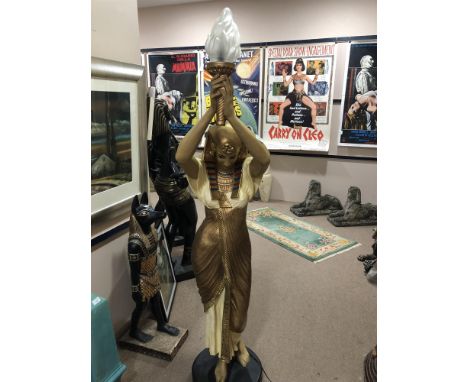 NEAR LIFE SIZE COMPOSITION LAMP, modelled in the form of a hand maiden, her head bowed, her two arms raised supporting the sh