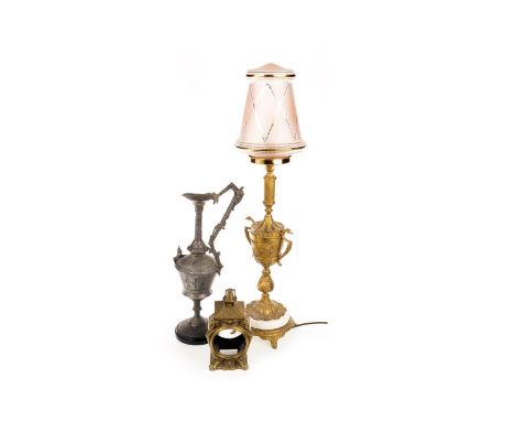 VICTORIAN CAST BRASS CLOCK CASE, with urn finial and sphinx cast corners, 21.5 cm high; along with a cast brass table lamp an