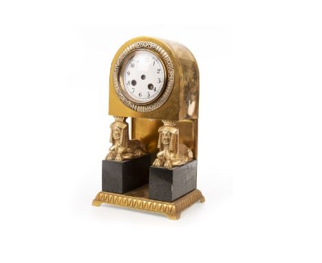 REGENCY STYLE BRASS CASED MANTEL CLOCK, the arched hood with a circular white enamel dial below, with Arabic numerals and 8 d