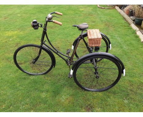A Ladies Loop Frame Tricycle,23 inch frame, painted black, fitted with 25inch diameter wheels, The Christy Hygienic saddle, L