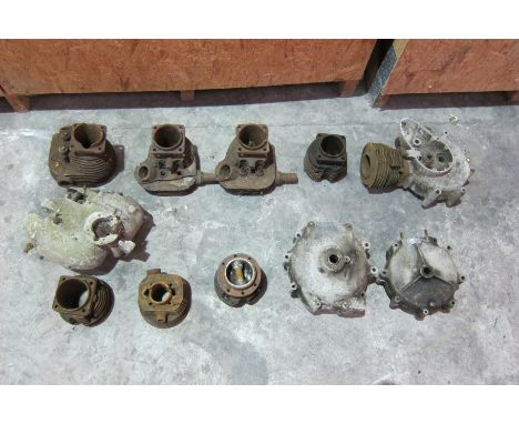 A selection of engine componentsincluding cylinder barrels, crankcases, and sundry parts, believed to include Rudge, Norton, 