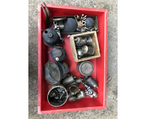 A mixed lot of Vintage era sparesincluding carburettors, control lever, front lamp and associated spares. (Qty)For further in