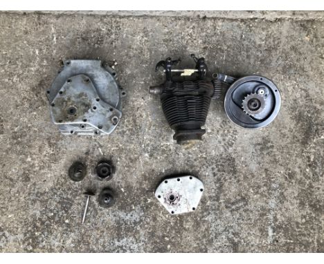 A disassembled Norton OHV enginenumbered ES37988, 79x100, comprising crankcases, flywheel, barrel, head and sundry components