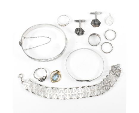 A collection of silver jewellery. The jewellery to include a hallmarked silver hinged bangle with engraved design, hallmarked