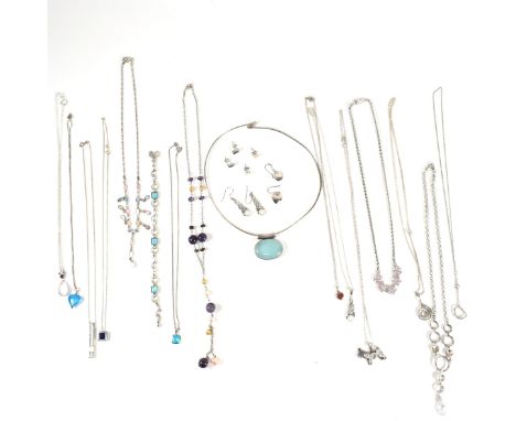 A large collection of silver and gem set jewellery. The lot to include silver necklace and earring sets, a necklace and brace