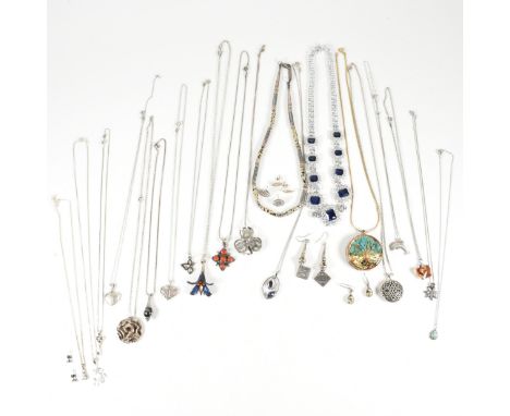 A collection of silver necklace pendants and necklace earring suites. The jewellery to include a dolphin pendant silver neckl