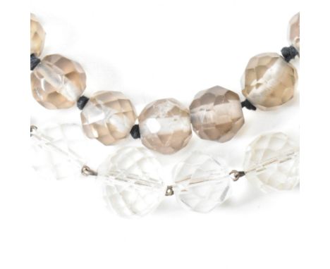 Two Art Deco rock crystal beaded necklaces. The lot to include a smoky quartz single strand beaded necklace and a clear rock 