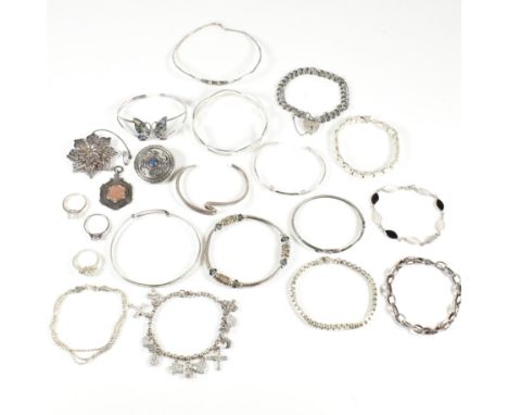 An assorted collection of silver and gem set jewellery. The lot to to include bangles, bracelets, gem set rings, necklace pen