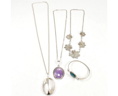 A collection of silver necklaces and bangle. The lot to include a German Kollmar &amp; Jourdan silver modernist pendant and c