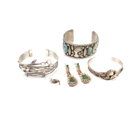 A collection of silver jewellery and a white tone metal cuff bangle. The lot to include a silver and moonstone set open cuff 
