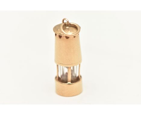 A 9CT GOLD OIL LAMP CHARM, fitted with a jump ring for suspension, hallmarked 9ct Birmingham, approximate gross weight 2.3 gr