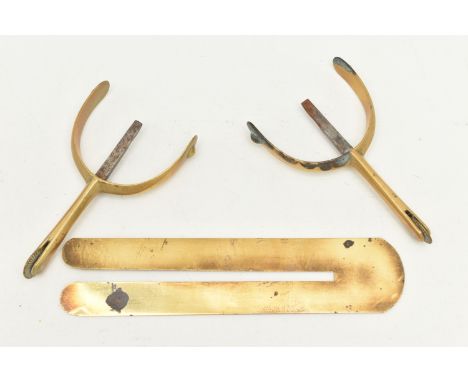 A PAIR OF BRASS STIRRUPS AND A BUTTON POLISHING GUARD