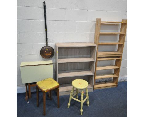 AN OAK EFFECT OPEN BOOKCASE, along with two pine bookcases, a formica drop leaf table, two stools, five mirrors, a shelf, and