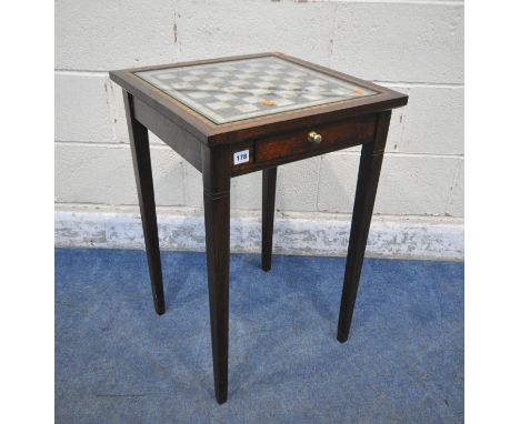 AN EDWARDIAN SQUARE MAHOGANY GAMES TABLE, with a chess table top, and two drawers, containing a quantity of playing cards, co