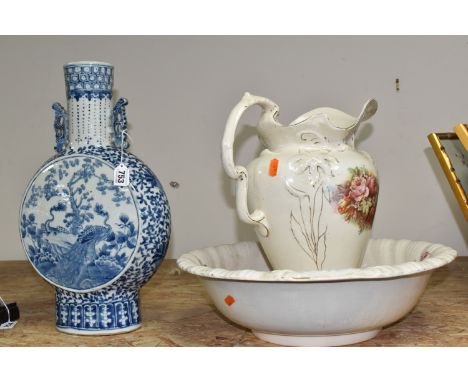 A CHINESE MOON FLASK AND A WASH JUG WITH A BASIN to include a blue and white Chinese moon flask with painted peacock landscap