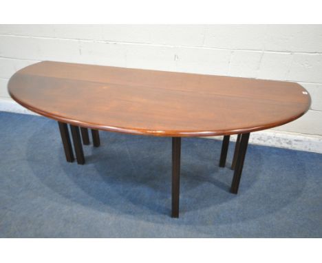 A REPRODUCTION MAHOGANY GATE LEG WAKE TABLE, that opens to an oval, on eight reeded legs, length 198cm x open depth 138cm clo