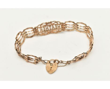 A 9CT GOLD GATE NAME BRACELET, a yellow gold gate bracelet, fitted with a central panel with the name 'Heather' set with two 