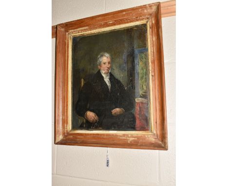 A VICTORIAN PORTRAIT OF A GENTLEMAN, the seated portrait depicts him sitting in a chair a holding a pair of glasses in his ri