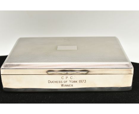 A 1970s WHITE METAL AND WOODEN CIGAR BOX, the box with engine turned surface detail, engraved C.P.C Duchess of York 1973 Winn
