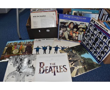A BOX OF MOSTLY BEATLES AND ROLLING STONES LPS to include twelve Rolling Stones records comprising two copies of 'Rolled Gold