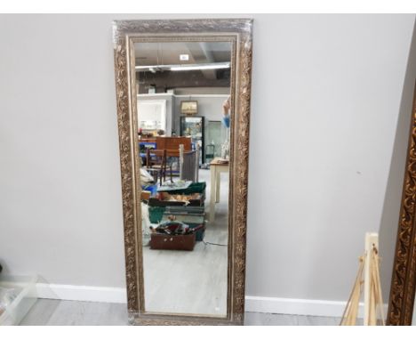 A MODERN WALL MIRROR WITH SILVER COLOURED SCROLLING FRAME 158 X 63CM