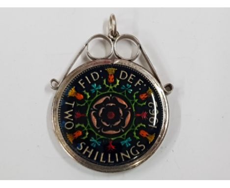 AN ENAMELLED TWO SHILLING COIN CONVERTED TO A PENDANT IN SILVER MOUNTS