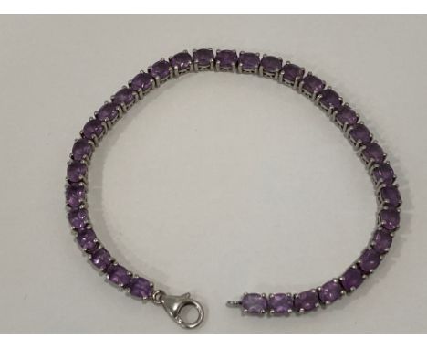 PURPLE STONE AND SILVER TENNIS BRACELET 19.5CM