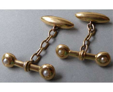 A pair of gold 18ct cufflinks with inset rubover half pearls c1900